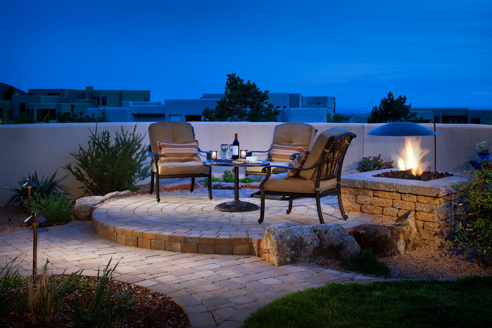 Patio - mid-sized southwestern backyard concrete paver patio idea in Albuquerque with a fire pit and no cover