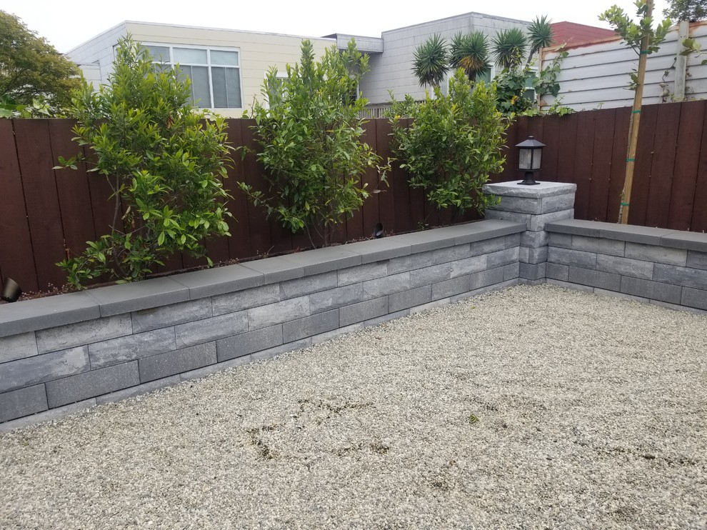 Small contemporary back garden in San Francisco with a potted garden and concrete paving.