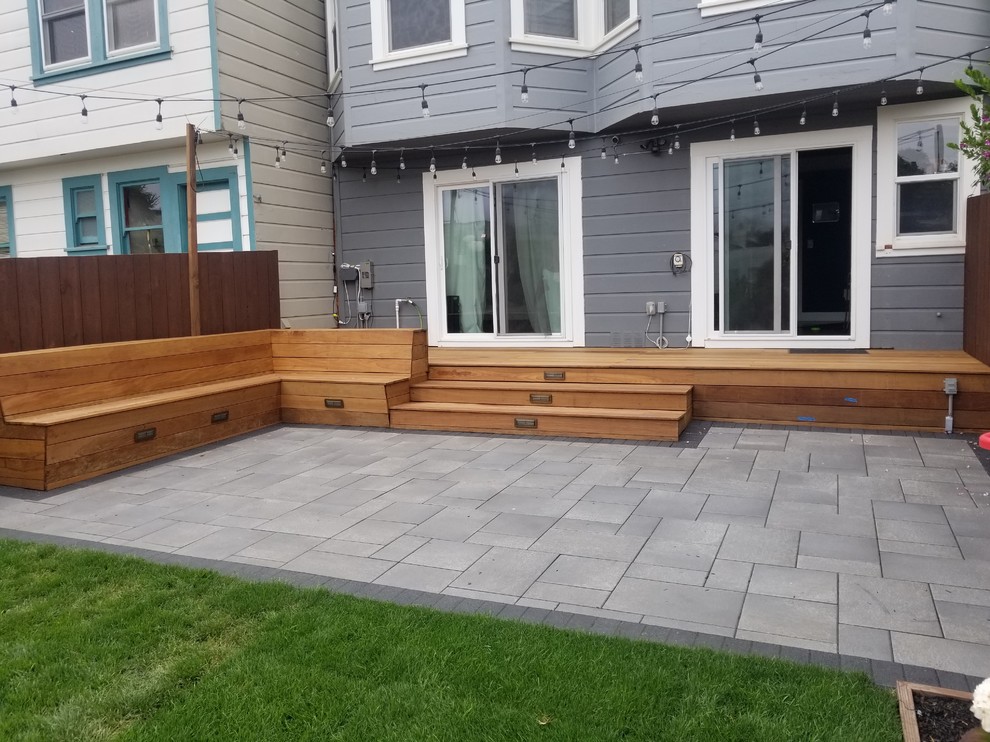 Immagine di un piccolo patio o portico design dietro casa con un giardino in vaso, pavimentazioni in cemento e nessuna copertura