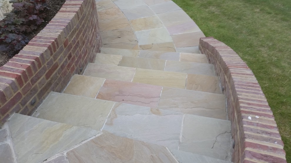 Large elegant backyard stone patio photo in Oxfordshire