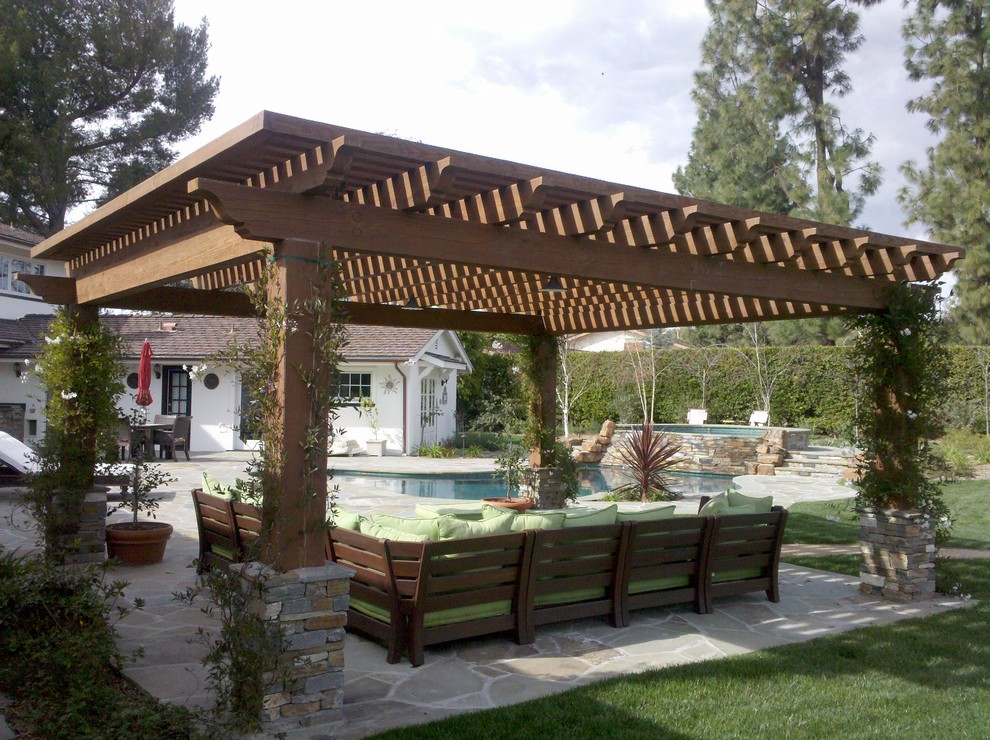 Design ideas for a contemporary patio in Los Angeles with a pergola.