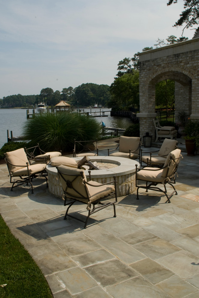 Inspiration for a traditional patio in Richmond with a fire feature.