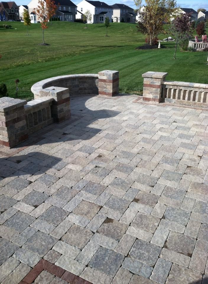 Inspiration for a mid-sized backyard brick patio remodel in Cleveland