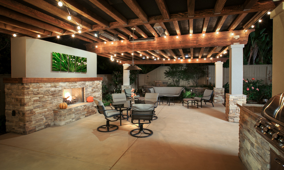 Large Patio Accented by Fireplace and Overhead Lights - Traditional
