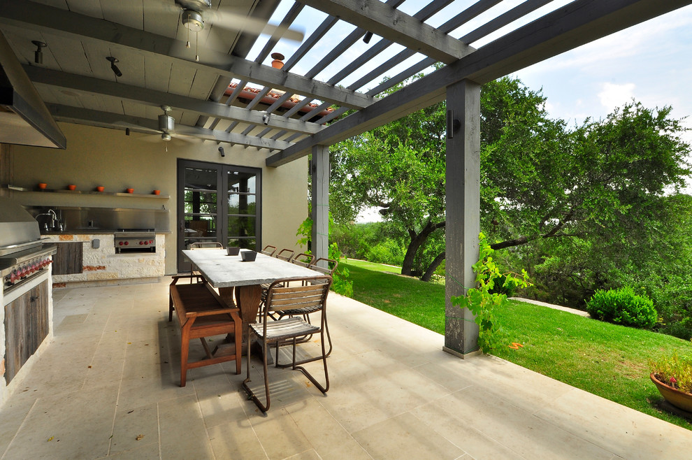 This is an example of a contemporary patio in Austin with a pergola and a bbq area.