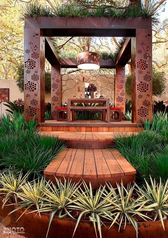 Large eclectic back patio in Melbourne with a pergola.