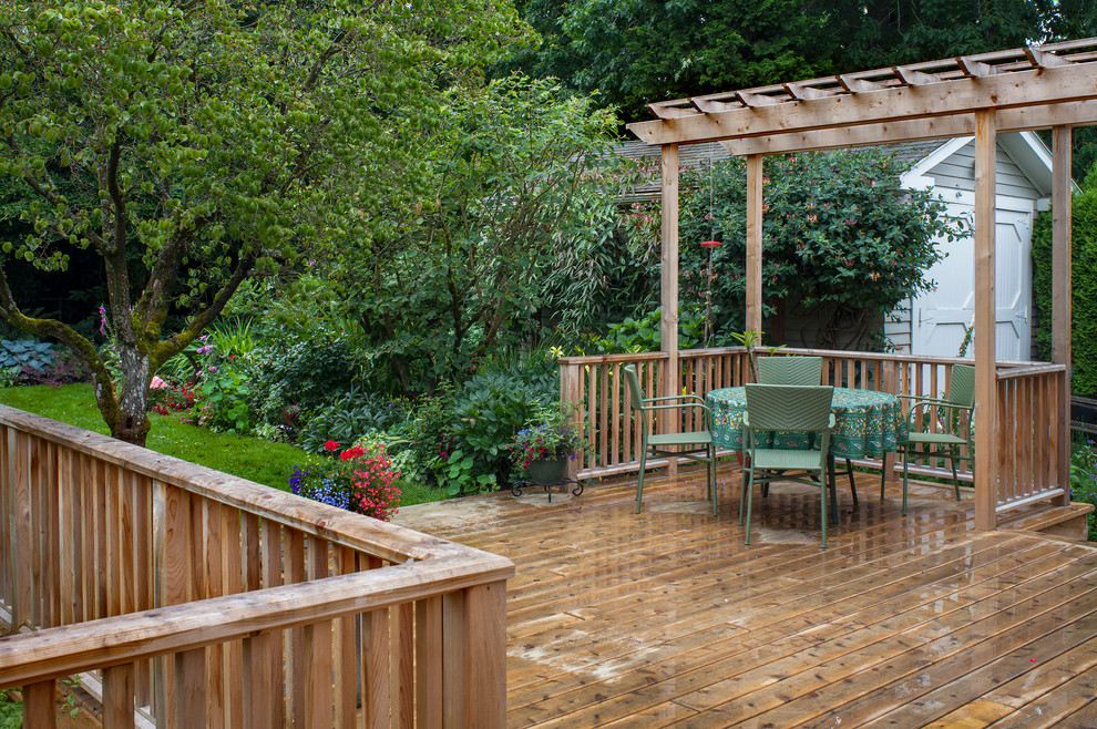 Design ideas for a medium sized classic back patio in Portland with decking and a pergola.