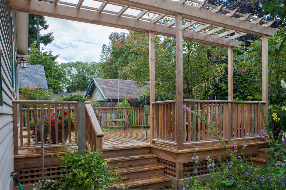 Inspiration for a medium sized traditional back patio in Portland with decking and a pergola.