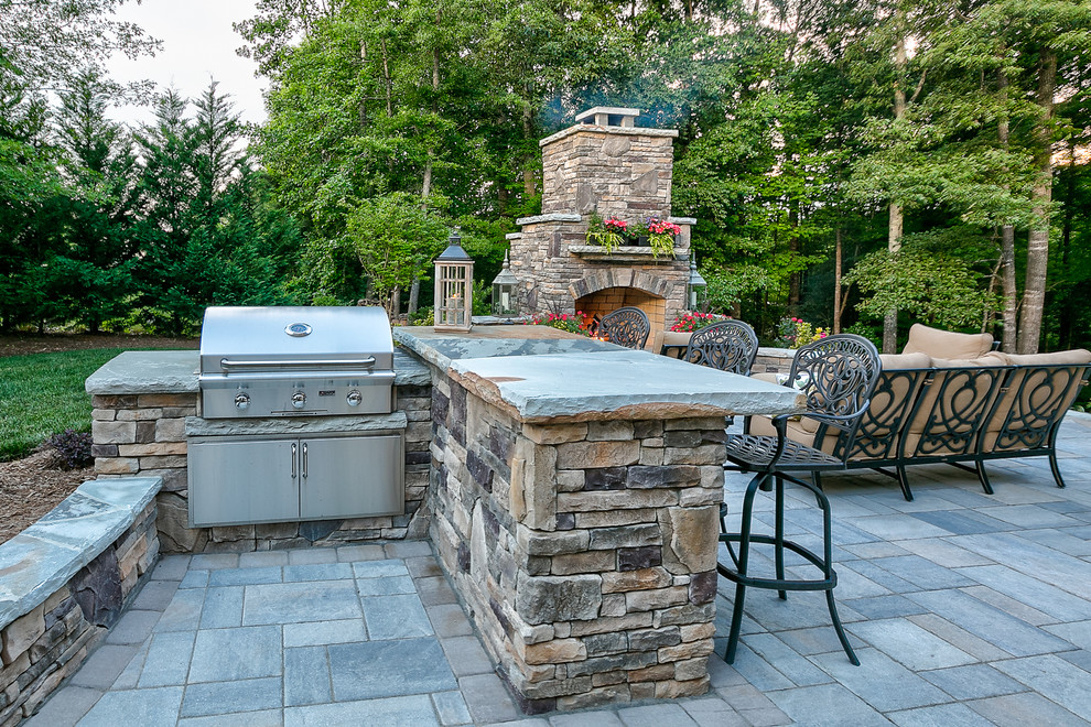 Inspiration for a medium sized traditional back patio in Charlotte with an outdoor kitchen, concrete paving and no cover.