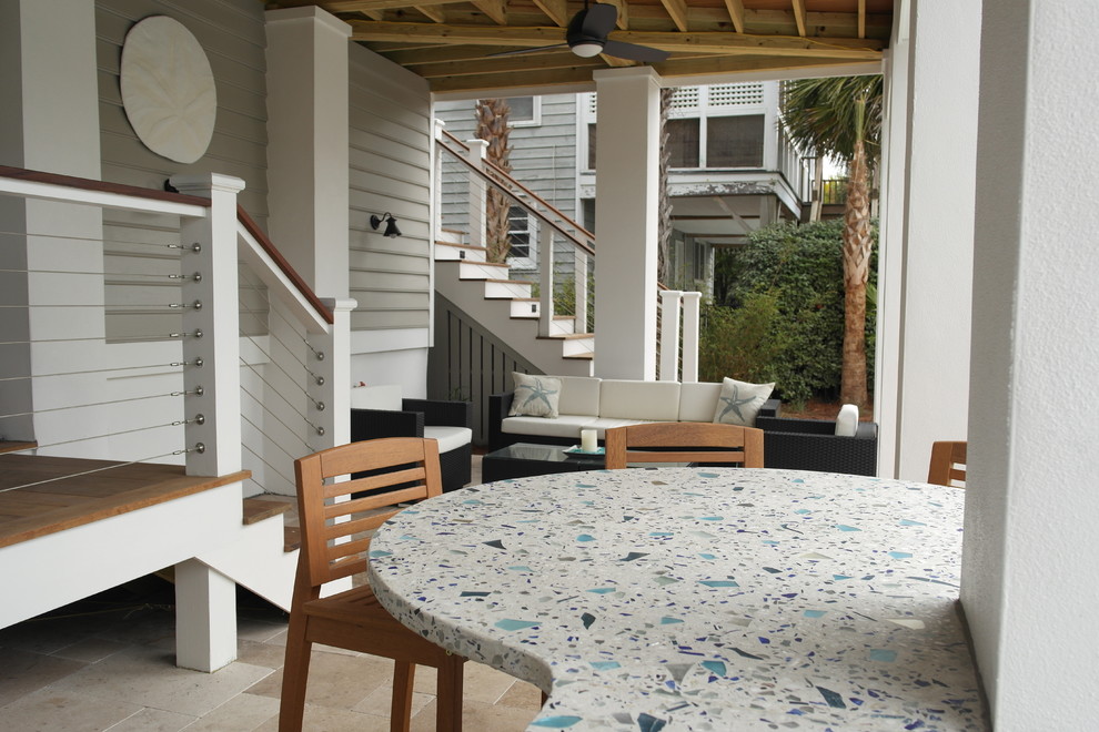 Example of a mid-sized beach style backyard tile patio kitchen design in Charleston with no cover