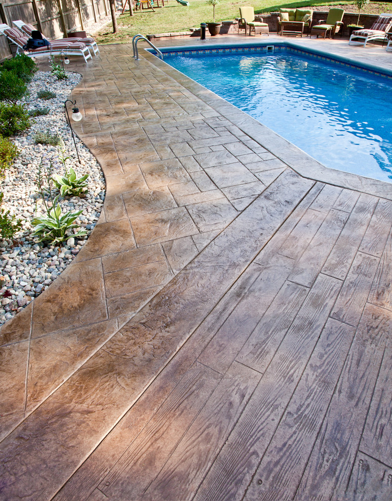 This is an example of a contemporary patio in Kansas City with stamped concrete.