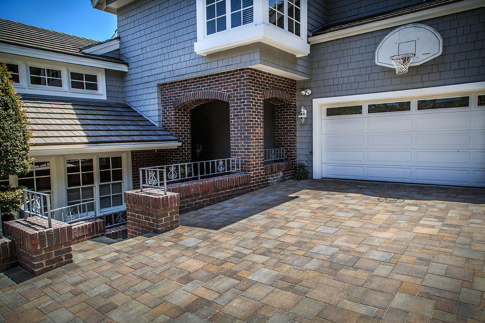 Contemporary patio in Orange County with brick paving.