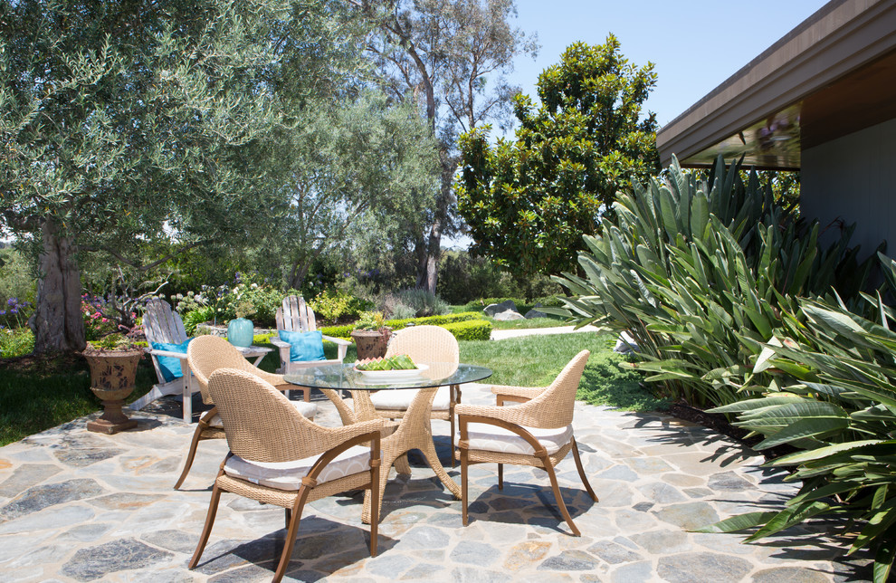 Inspiration for a medium sized traditional side patio in San Diego with natural stone paving.