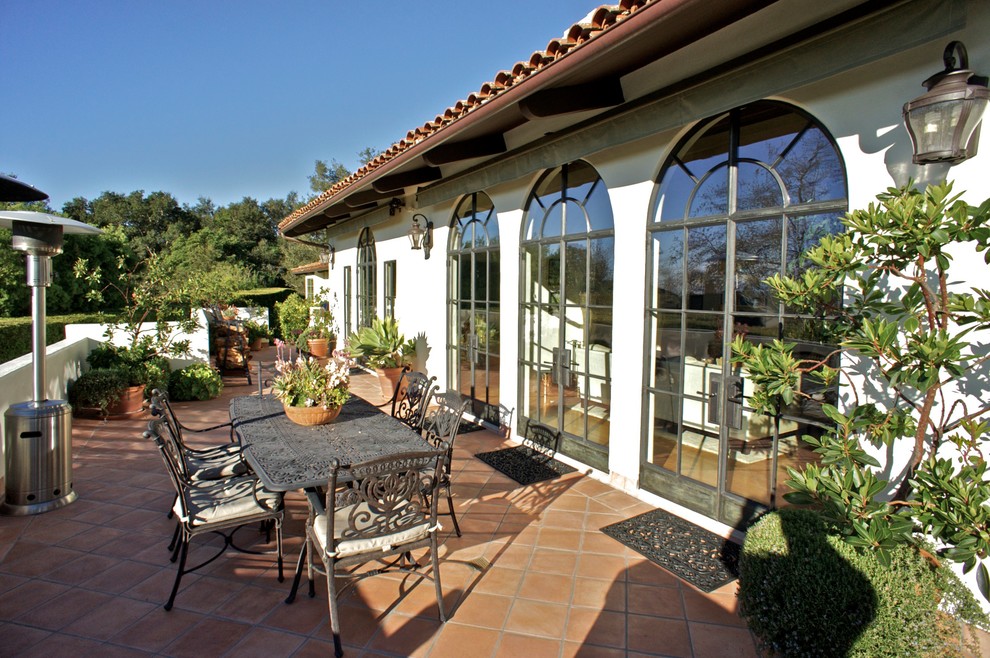 Photo of a mediterranean patio in Santa Barbara with tiled flooring and no cover.