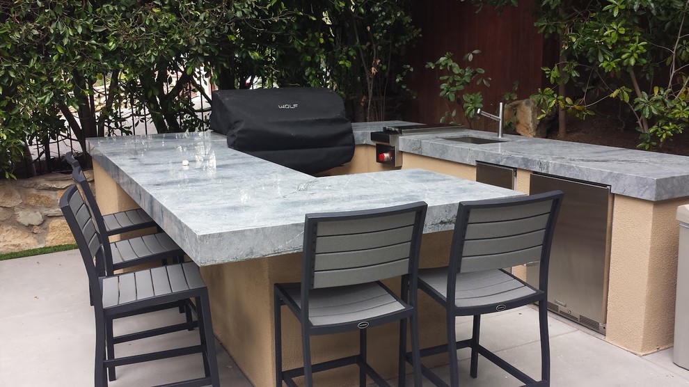 Design ideas for a large contemporary back patio in San Diego with an outdoor kitchen, concrete paving and no cover.