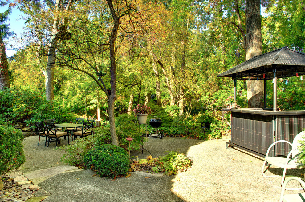 Example of a classic patio design in Chicago with a gazebo