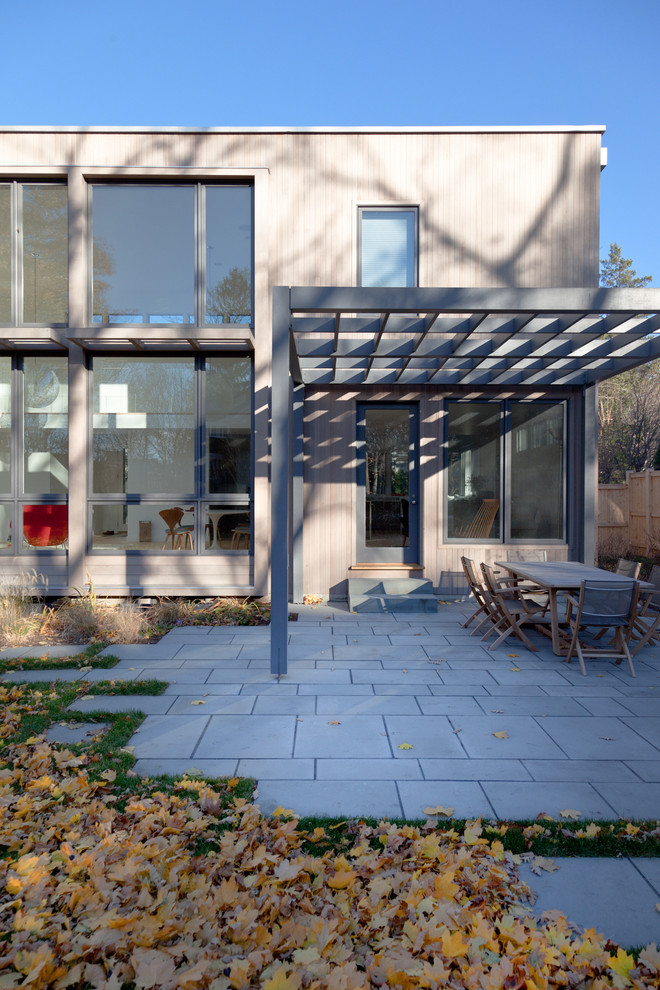 Design ideas for a contemporary patio in Boston with a pergola.
