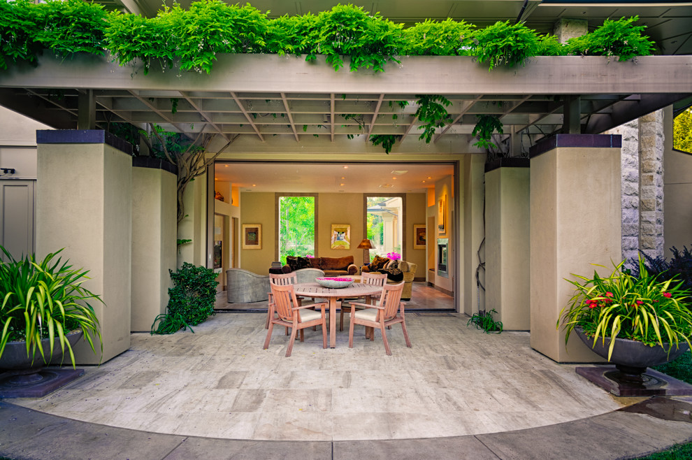 Example of a transitional patio design in San Francisco with a pergola