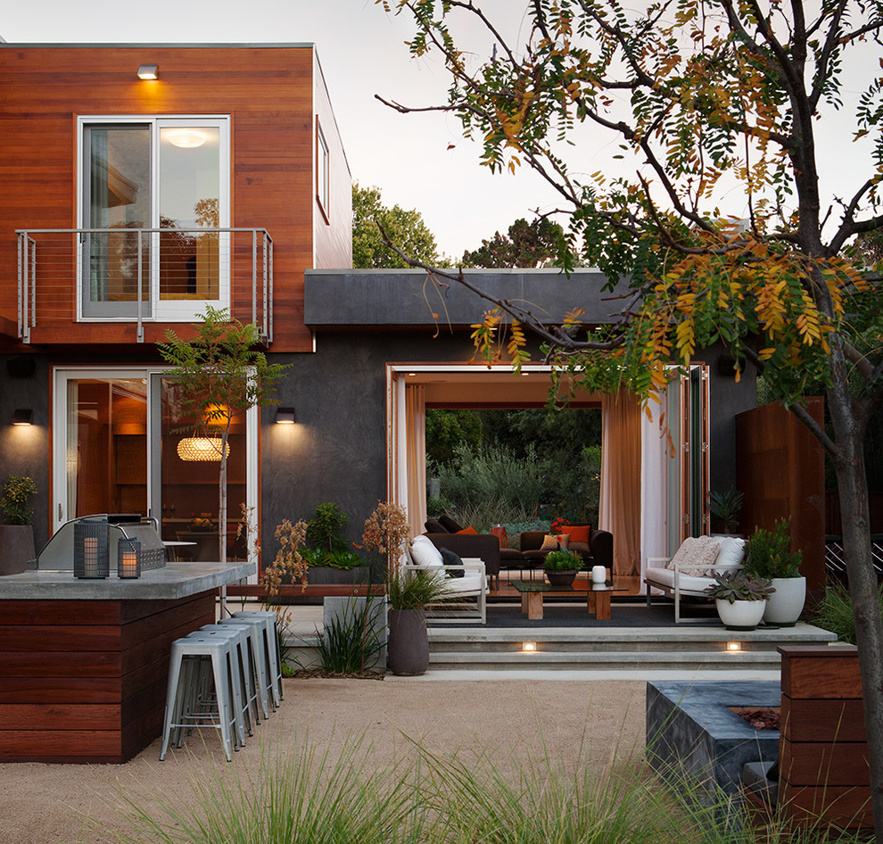 Example of a large trendy backyard concrete patio design in San Francisco with no cover