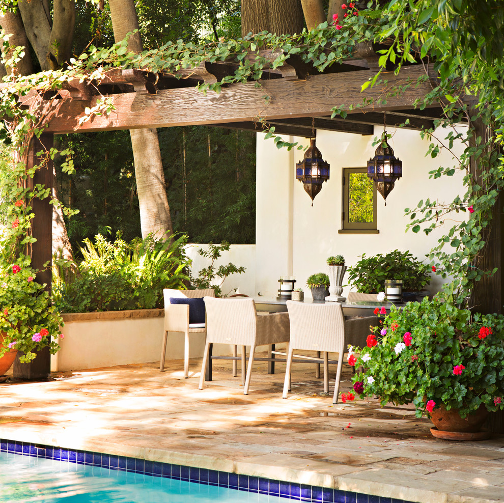 Design ideas for a mediterranean back patio in Los Angeles with a pergola.