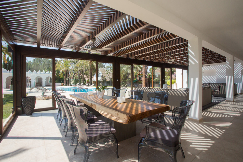 Design ideas for a large contemporary patio in Other with a pergola.