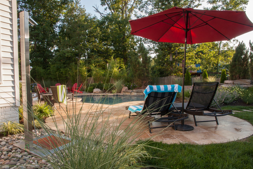 Design ideas for a small bohemian back patio in DC Metro with a water feature and concrete paving.