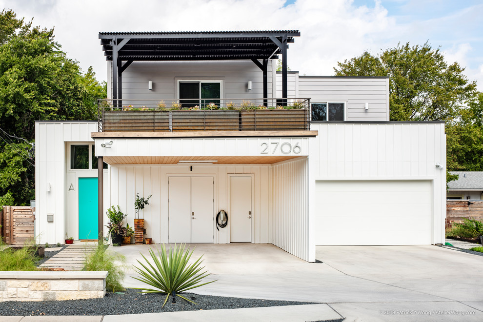 Idee per un patio o portico minimalista dietro casa con una pergola