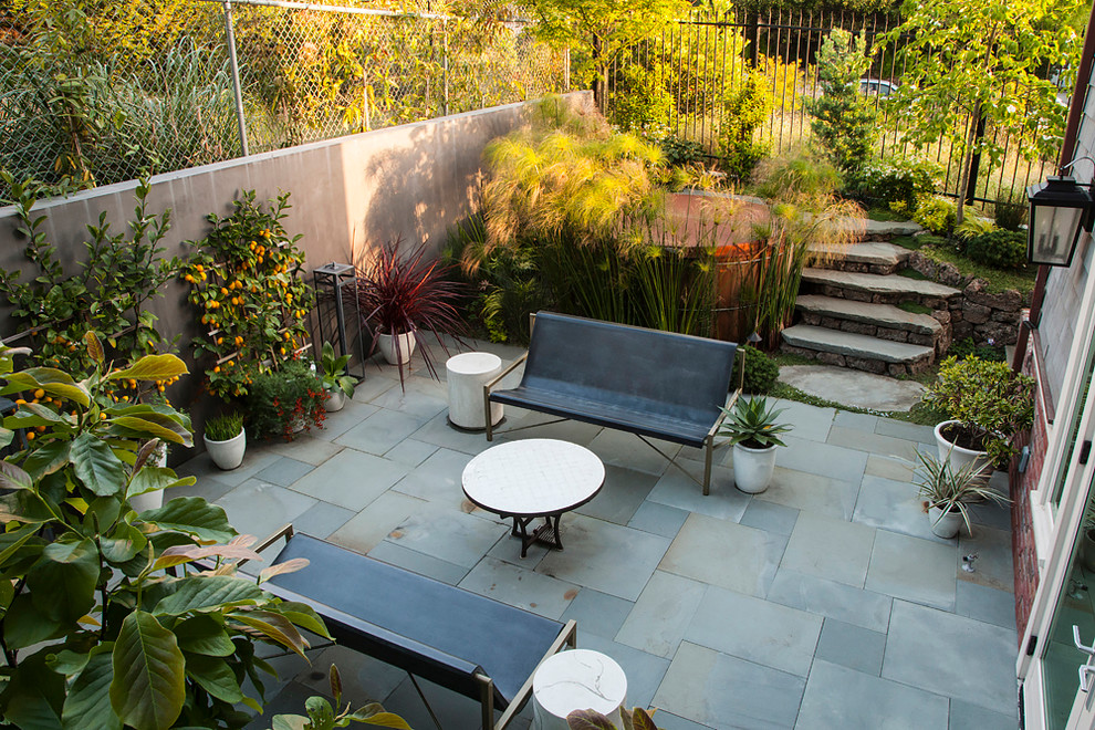 Patio - large traditional backyard concrete paver patio idea in San Francisco with no cover