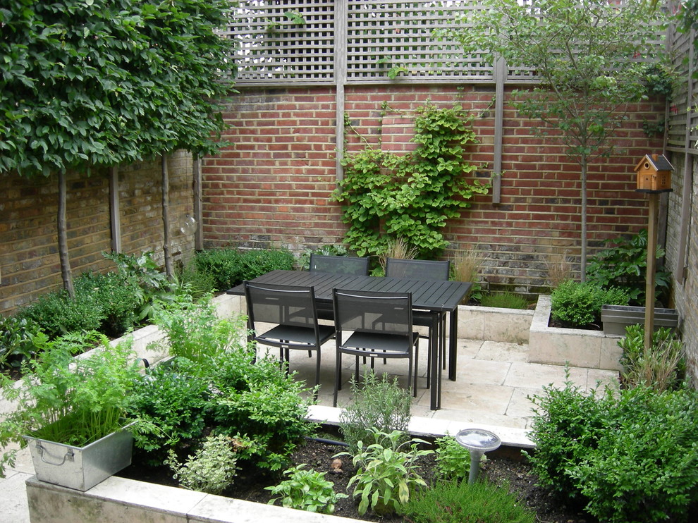 This is an example of a contemporary patio in Hertfordshire.