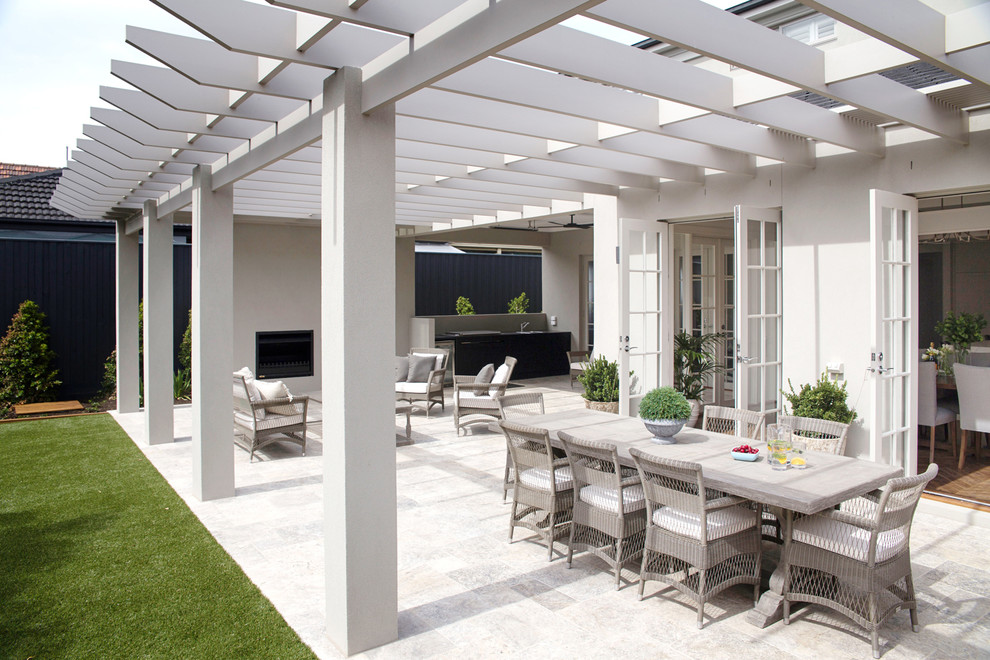 Inspiration for a large classic back patio in Melbourne with a fire feature and a pergola.