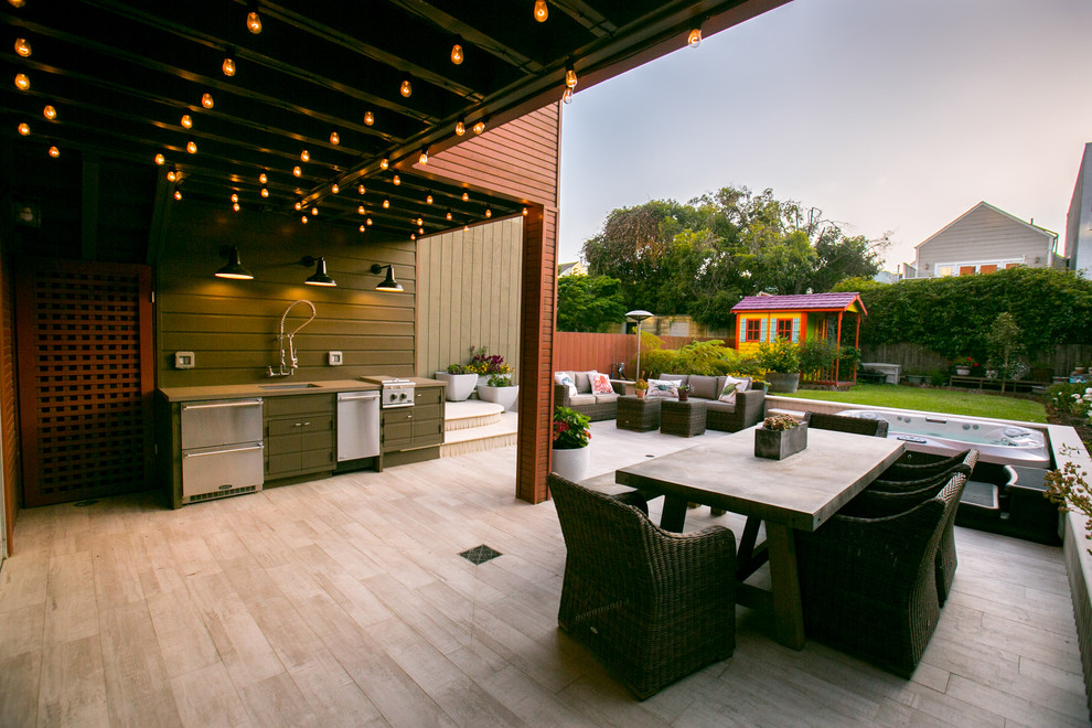 Patio kitchen - large contemporary backyard patio kitchen idea in San Francisco with decking and a roof extension