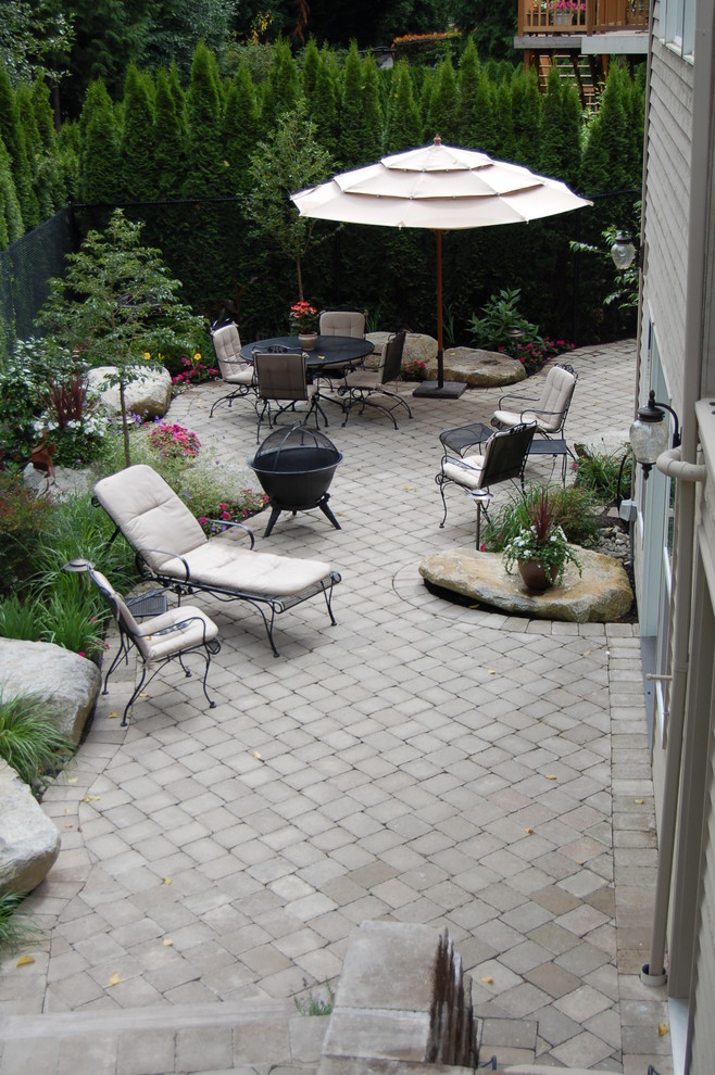 Photo of a classic patio in Seattle with concrete paving.