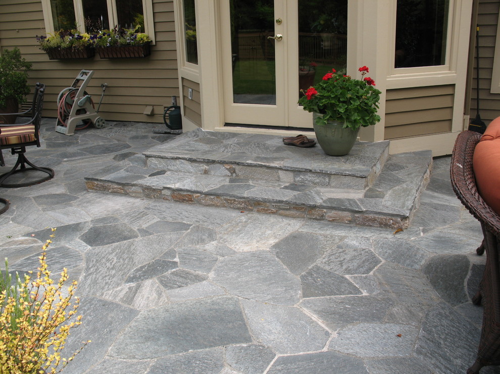 Example of a classic stone patio design in Seattle