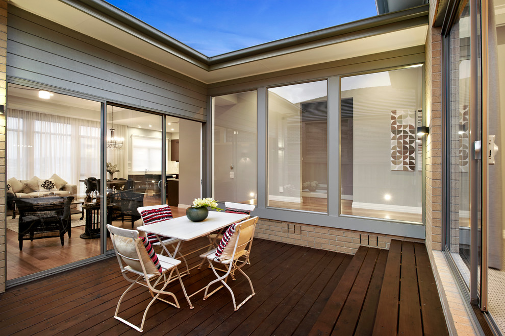 Photo of a contemporary patio in Melbourne with decking and no cover.
