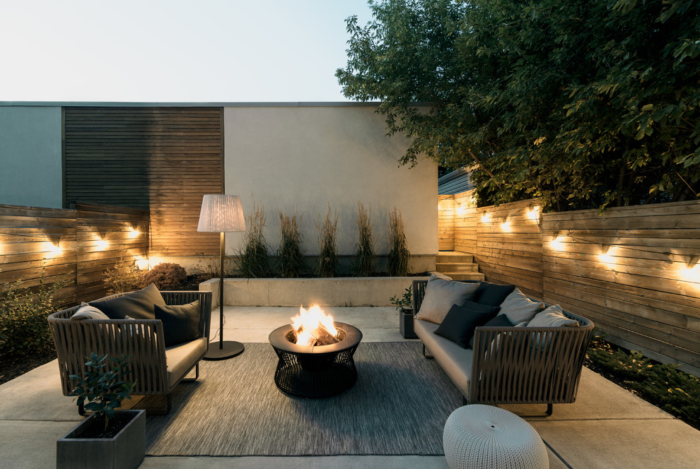 Trendy concrete patio photo in Calgary with no cover