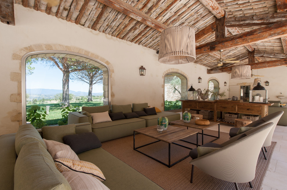 Huge tuscan patio photo in Other with a roof extension