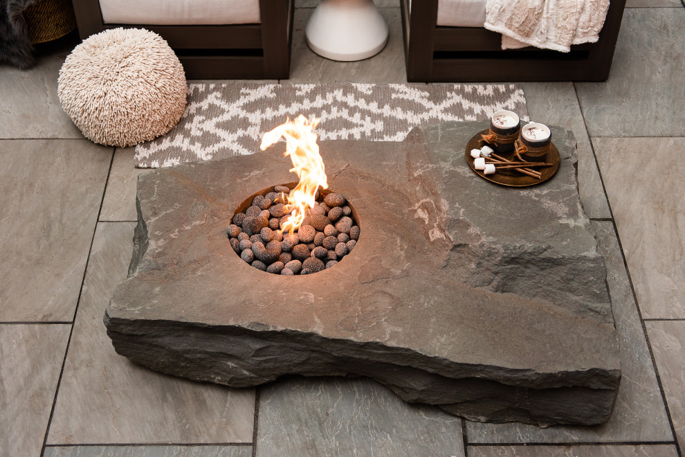 Design ideas for a medium sized modern back patio in Richmond with a fire feature and natural stone paving.