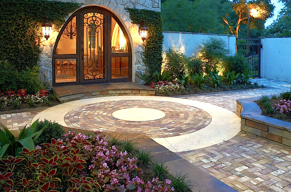Design ideas for a mediterranean patio in Other with brick paving.