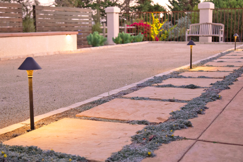 Inspiration for a large mediterranean back patio in San Luis Obispo with natural stone paving.