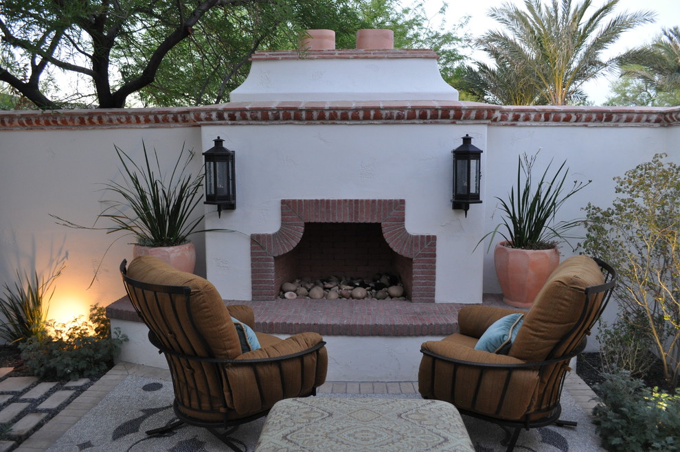 Patio - mediterranean courtyard patio idea in Phoenix with a fire pit