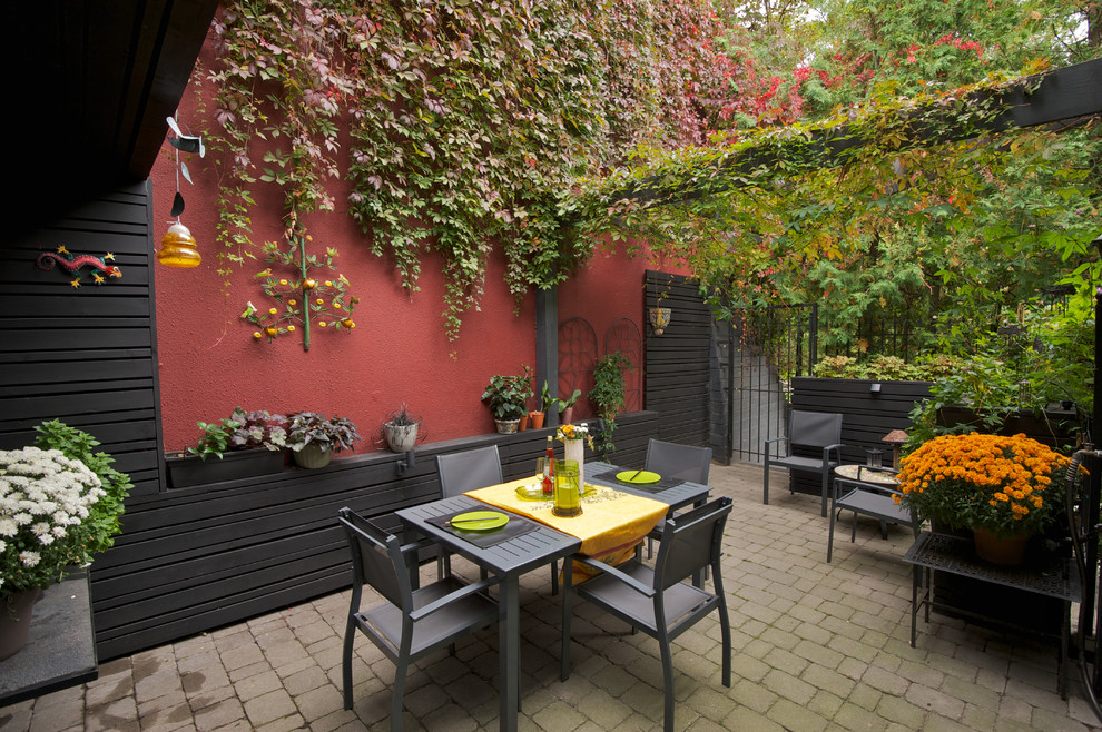 Trendy patio photo in Toronto with a pergola
