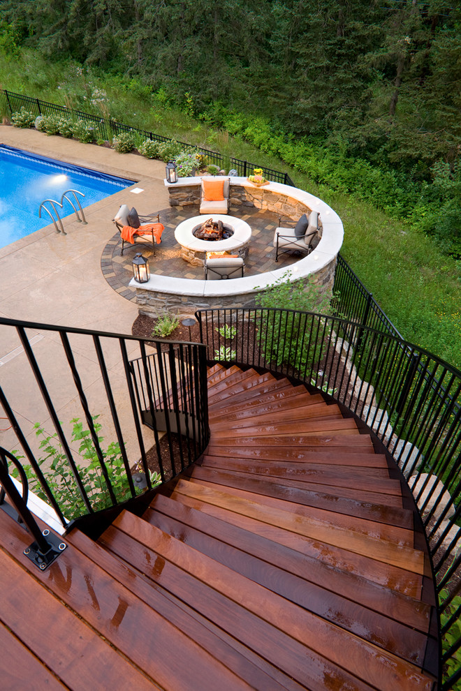 Elegant patio photo in Minneapolis with a fire pit and decking