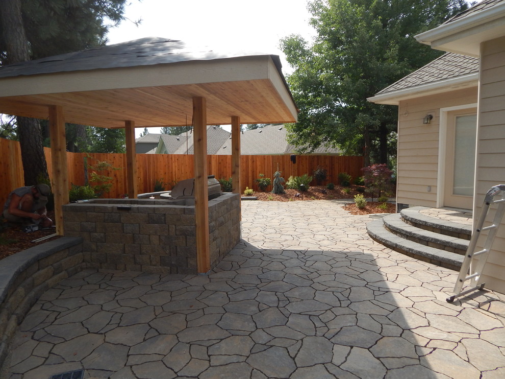 Design ideas for a rustic patio in Seattle with concrete paving.
