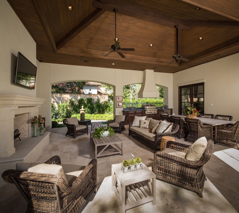 Inspiration for a large rustic backyard stone patio remodel in Houston with a fire pit and a roof extension