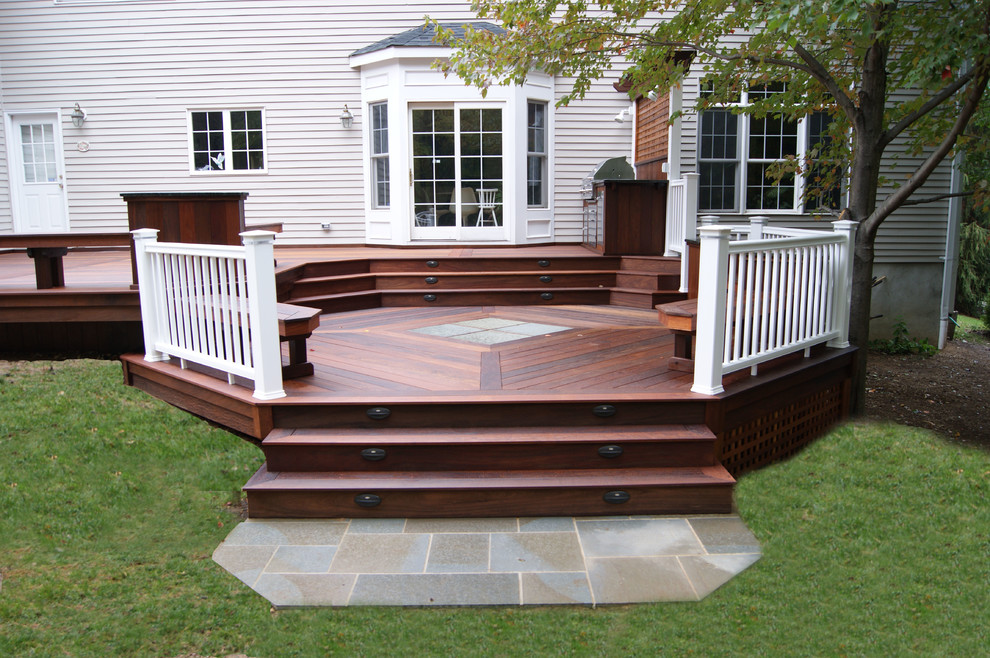 Patio kitchen - large traditional backyard patio kitchen idea in New York with decking and no cover