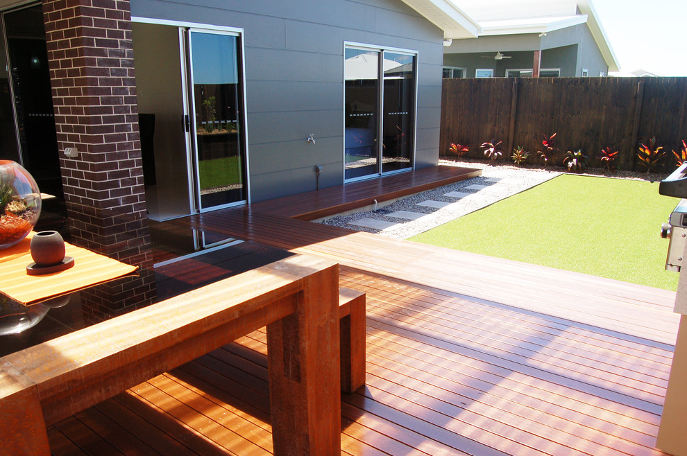 Inspiration for a small contemporary backyard patio kitchen remodel in Other with decking and a pergola