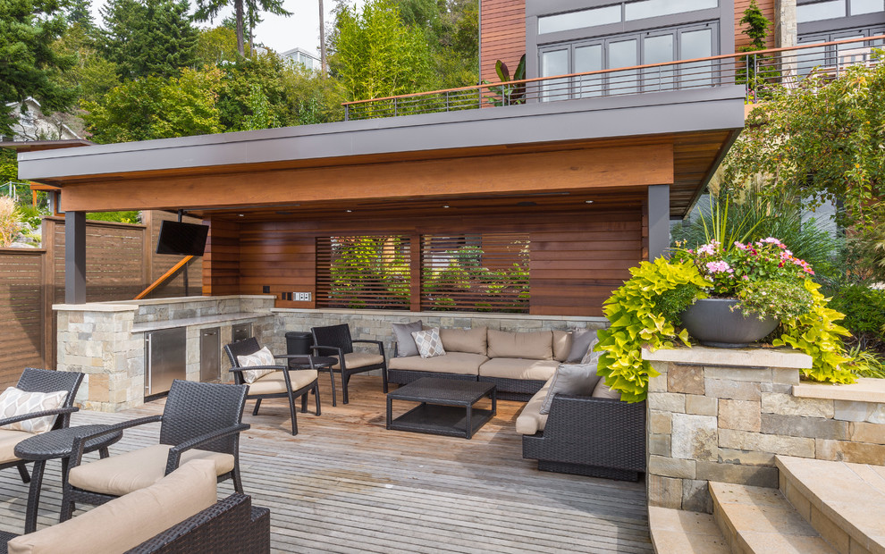 Large trendy backyard patio kitchen photo in Seattle with decking and a gazebo