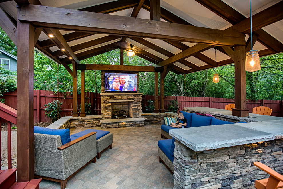 Patio - mid-sized craftsman backyard concrete paver patio idea in Charlotte with a fire pit and a gazebo
