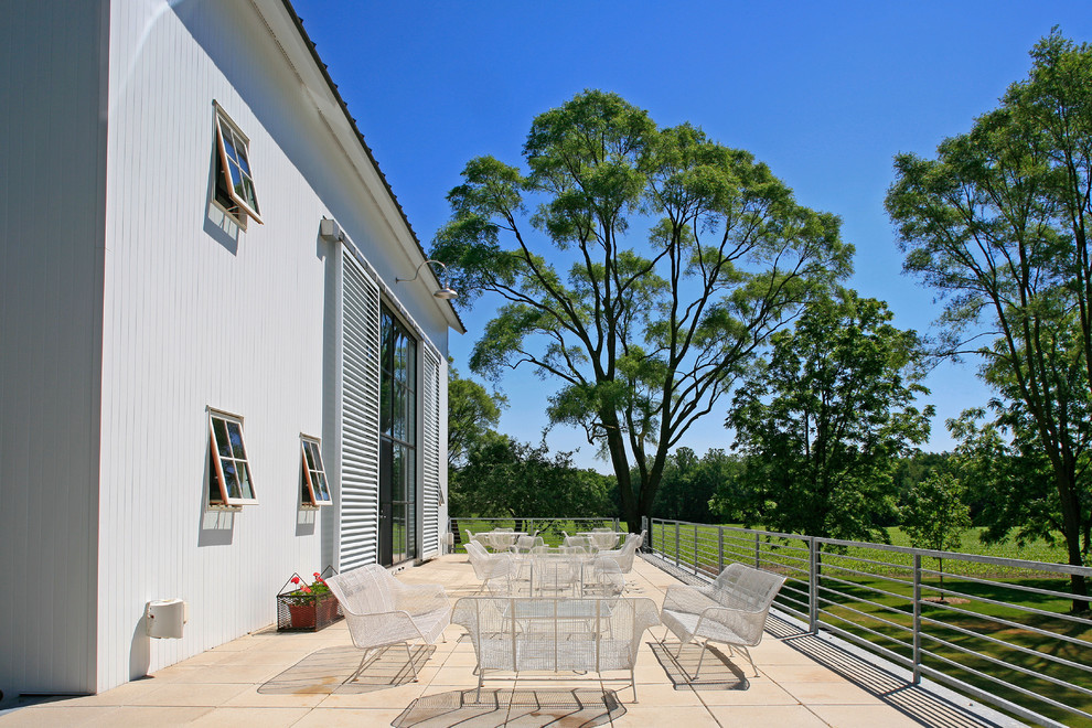 Farmhouse patio photo in Detroit with no cover