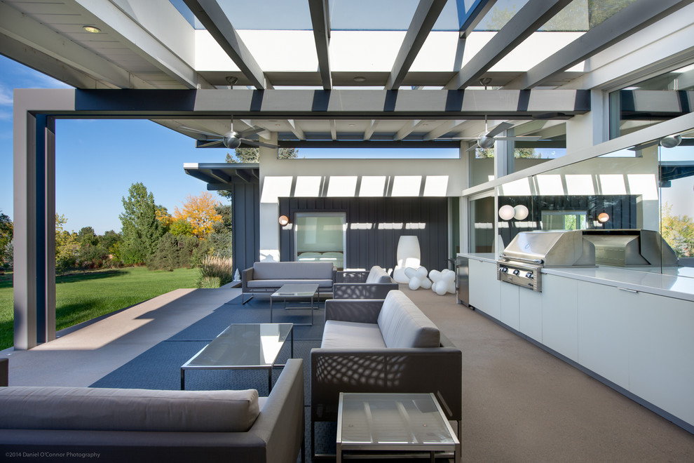 Patio - mid-century modern patio idea in Denver